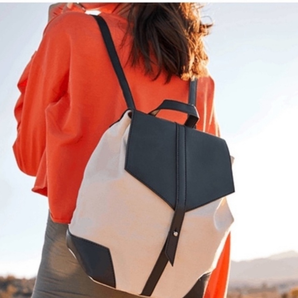 Deux Lux black faux leather and cream canvas backpack bag